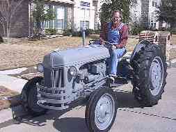 man sitting on shiny tractor