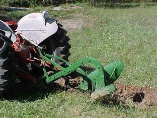 tractor with plow at steep angle